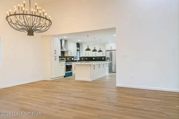a view of a room with cabinet and air conditioner