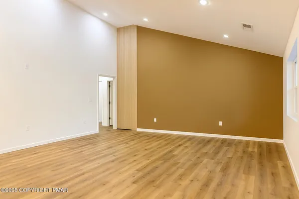 a kitchen with a sink a stove and cabinets