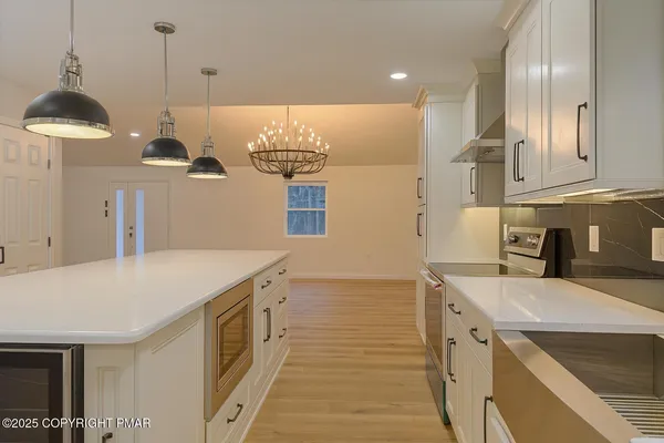 a kitchen with a sink and cabinets