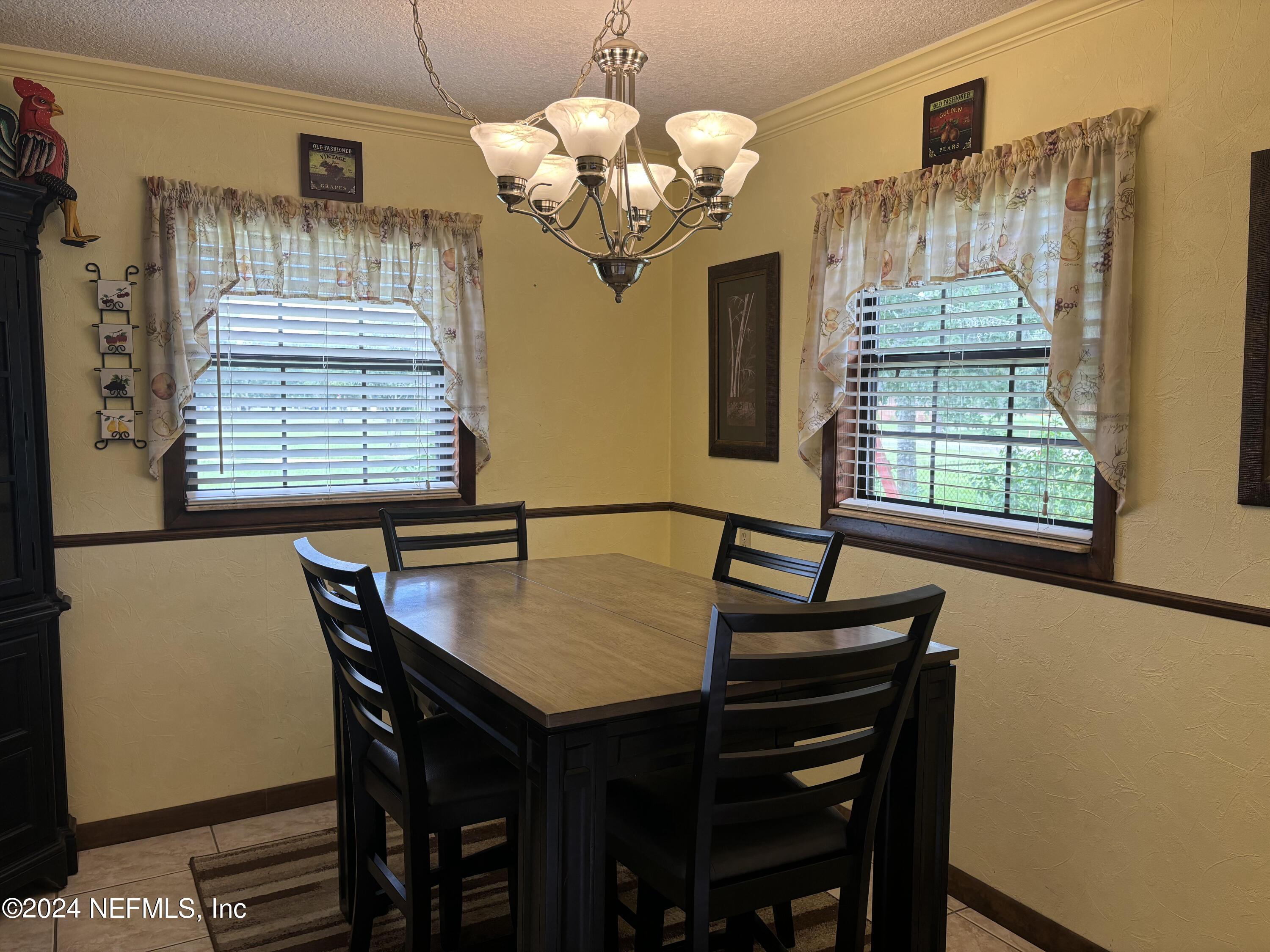 2700 New Berlin Road Jacksonville, FL 32226 - Photo 15 of 42 a view of a dining room with furniture window and wooden floor