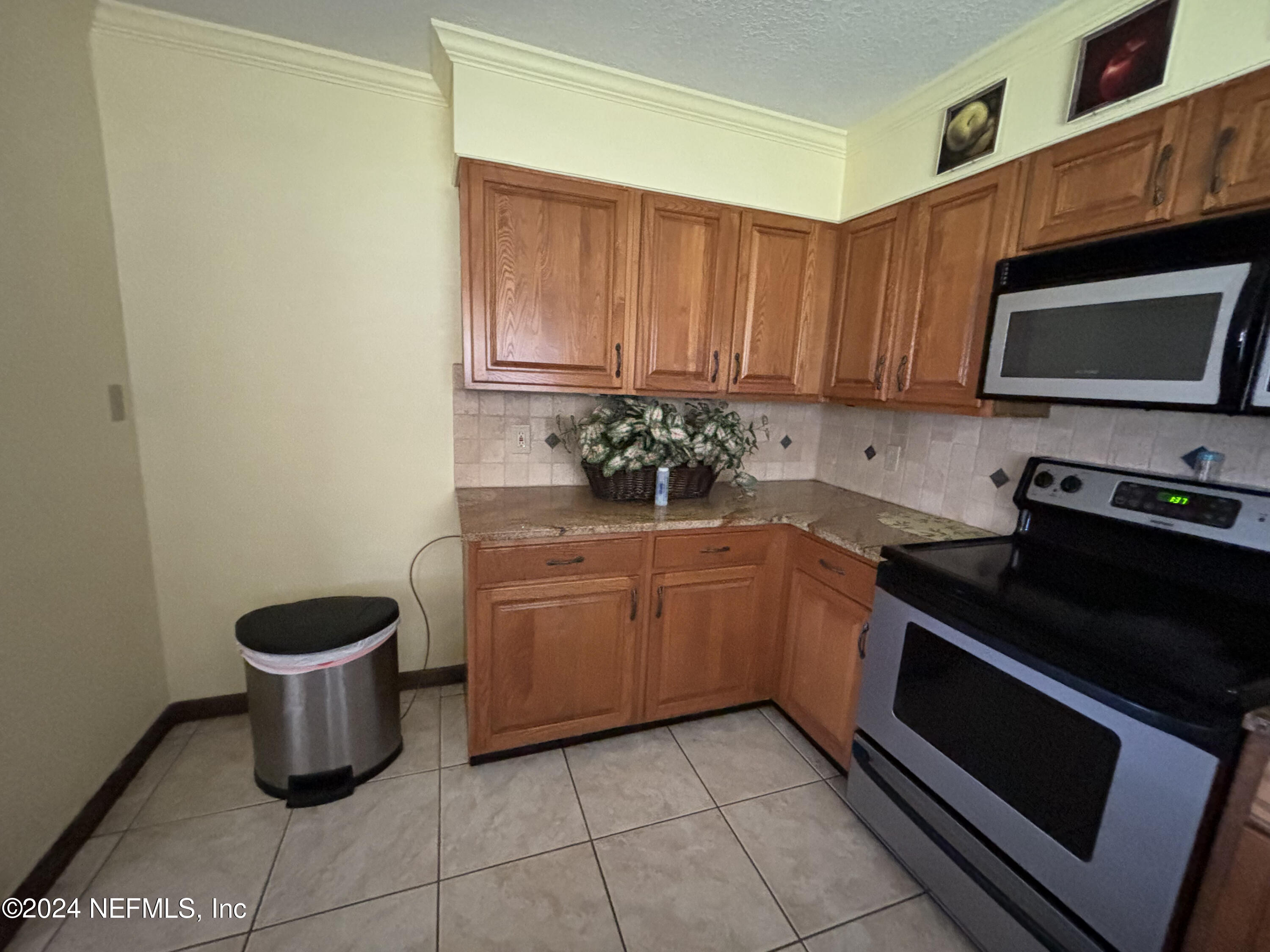 2700 New Berlin Road Jacksonville, FL 32226 - Photo 19 of 42 a kitchen with a sink and a stove top oven
