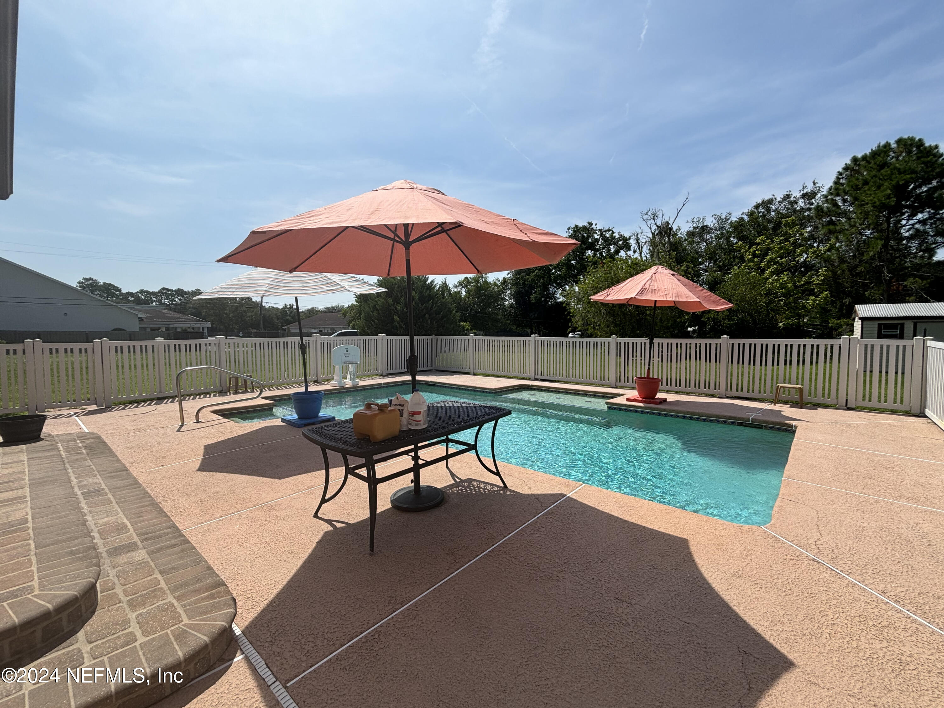 2700 New Berlin Road Jacksonville, FL 32226 - Photo 31 of 42 a view of swimming pool with lounge chair in the backyard