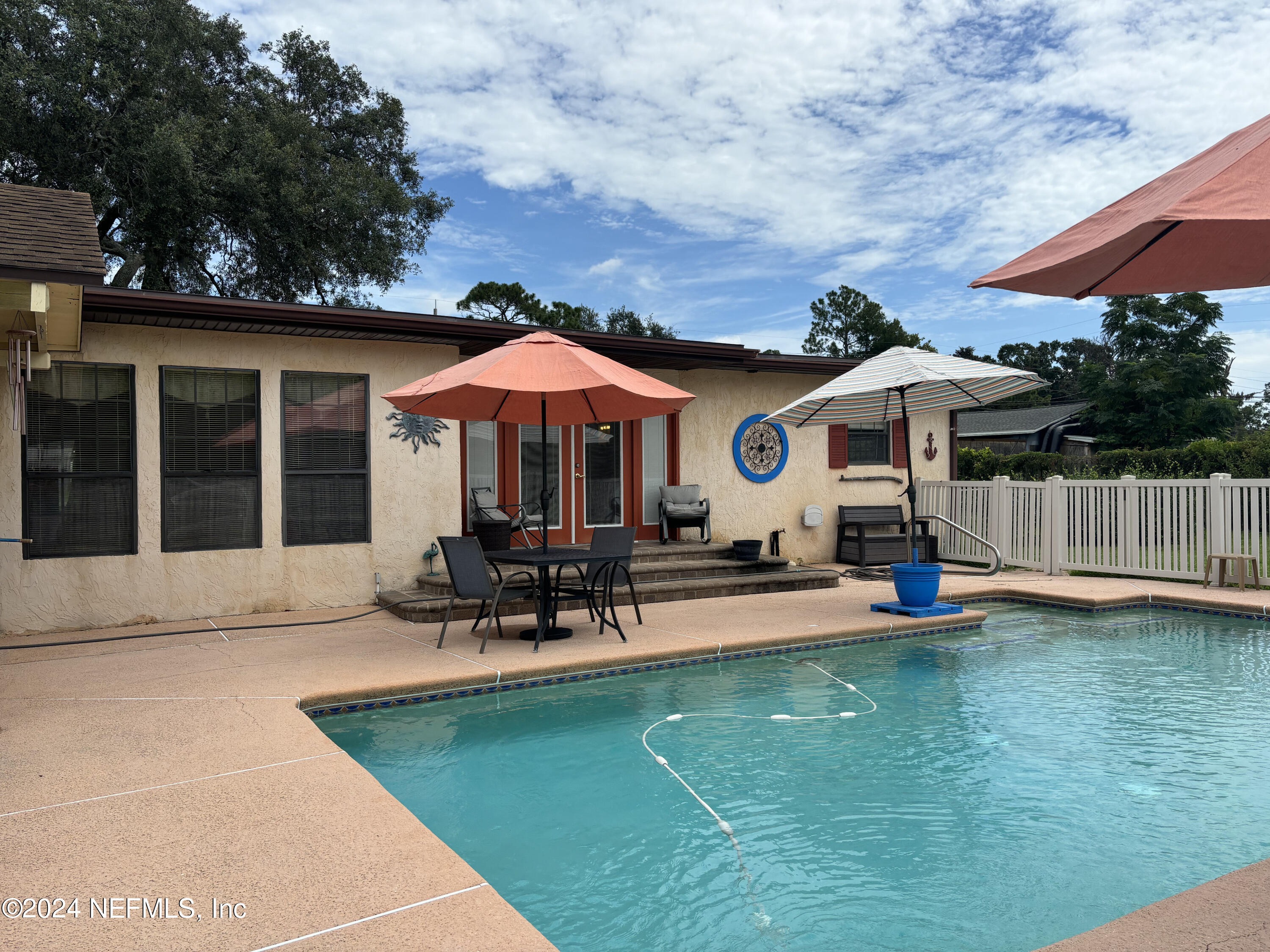 2700 New Berlin Road Jacksonville, FL 32226 - Photo 33 of 42 a view of a house with swimming pool and sitting area