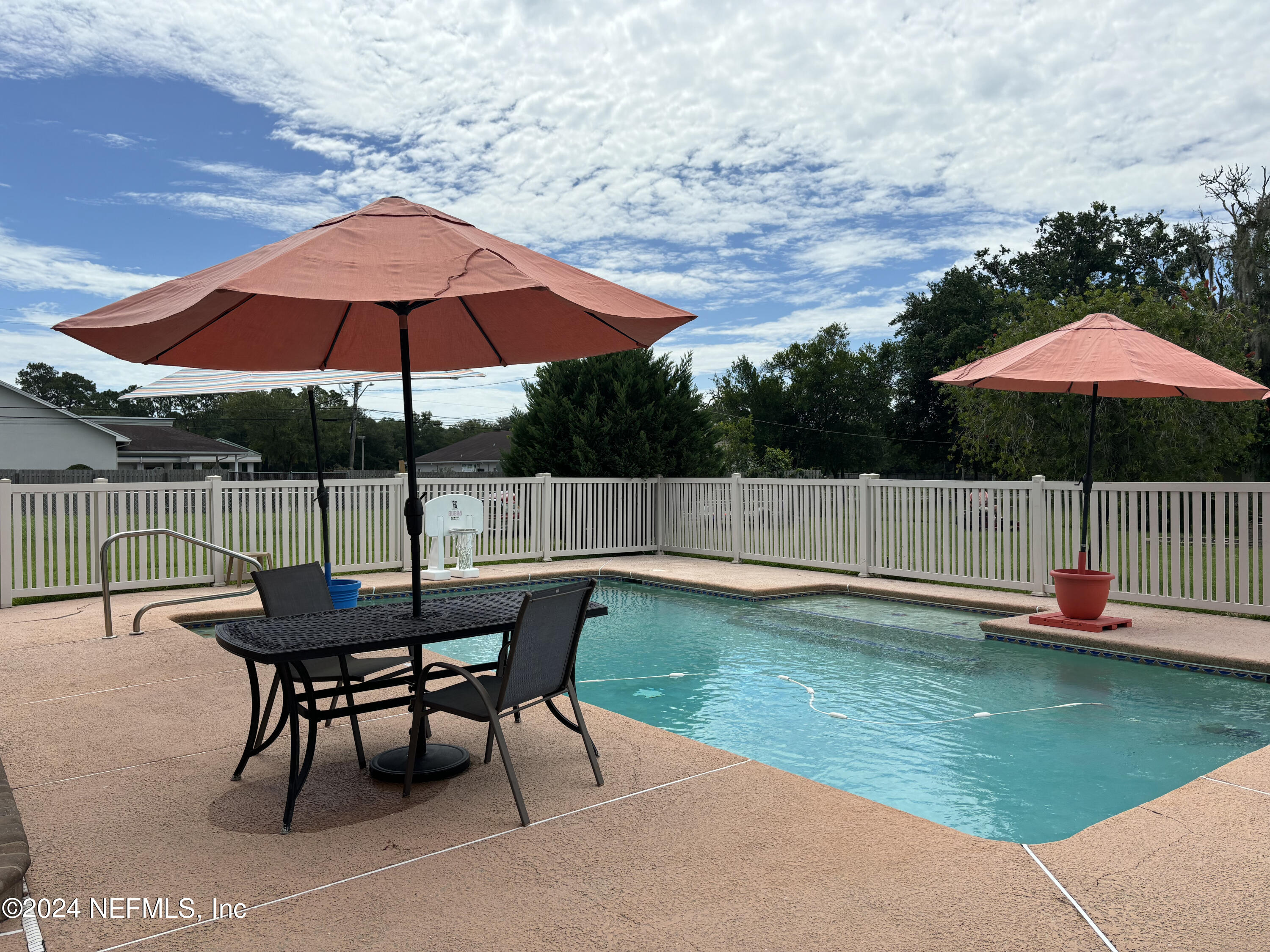 2700 New Berlin Road Jacksonville, FL 32226 - Photo 34 of 42 a patio with a table and chairs