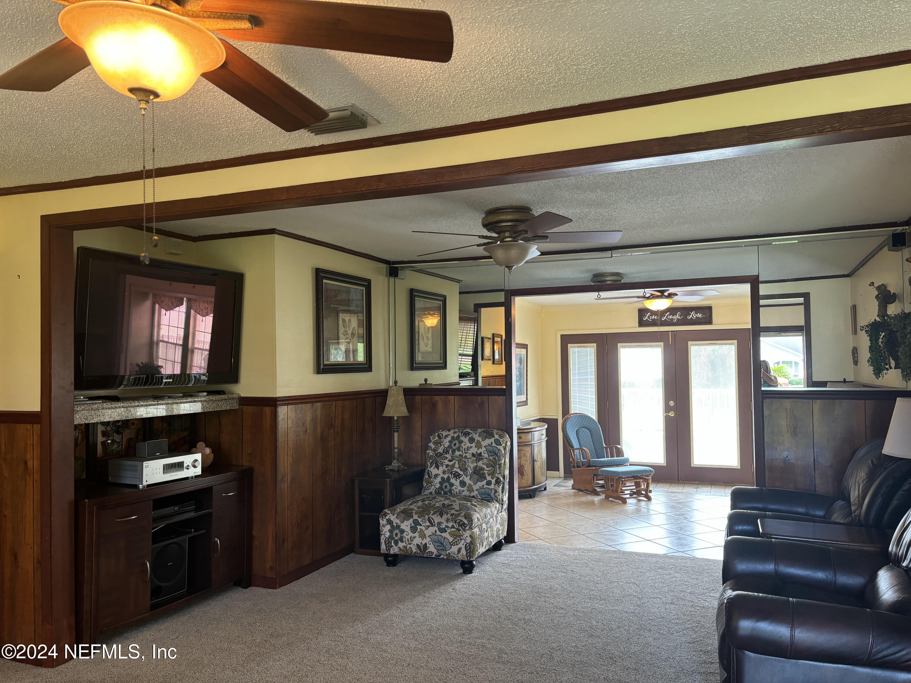 2700 New Berlin Road Jacksonville, FL 32226 - Photo 7 of 42 a living room with furniture and a flat screen tv