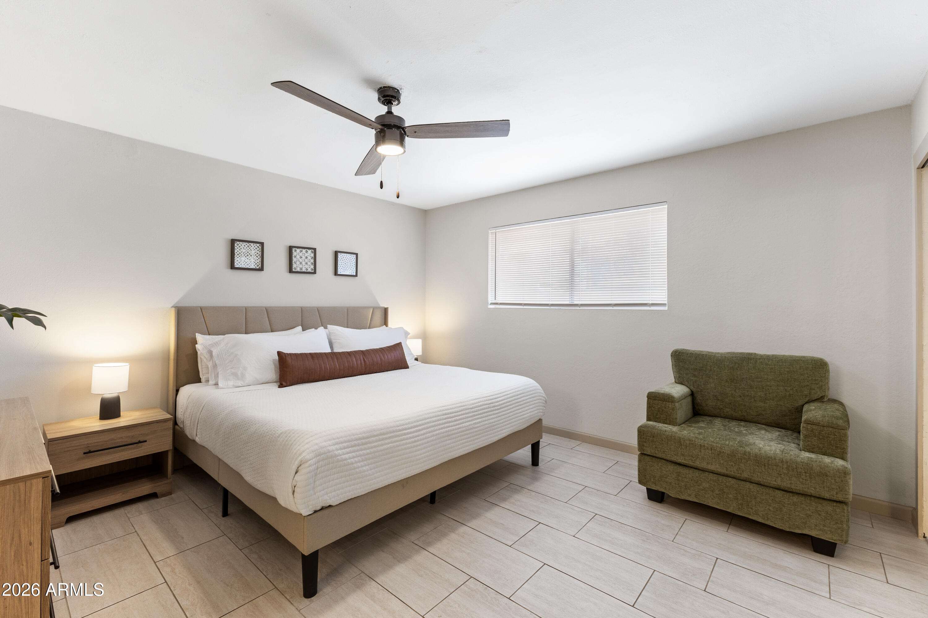 111 South Cholla Street Gilbert, AZ 85233 - Photo 21 of 34 a bedroom with a bed and couch