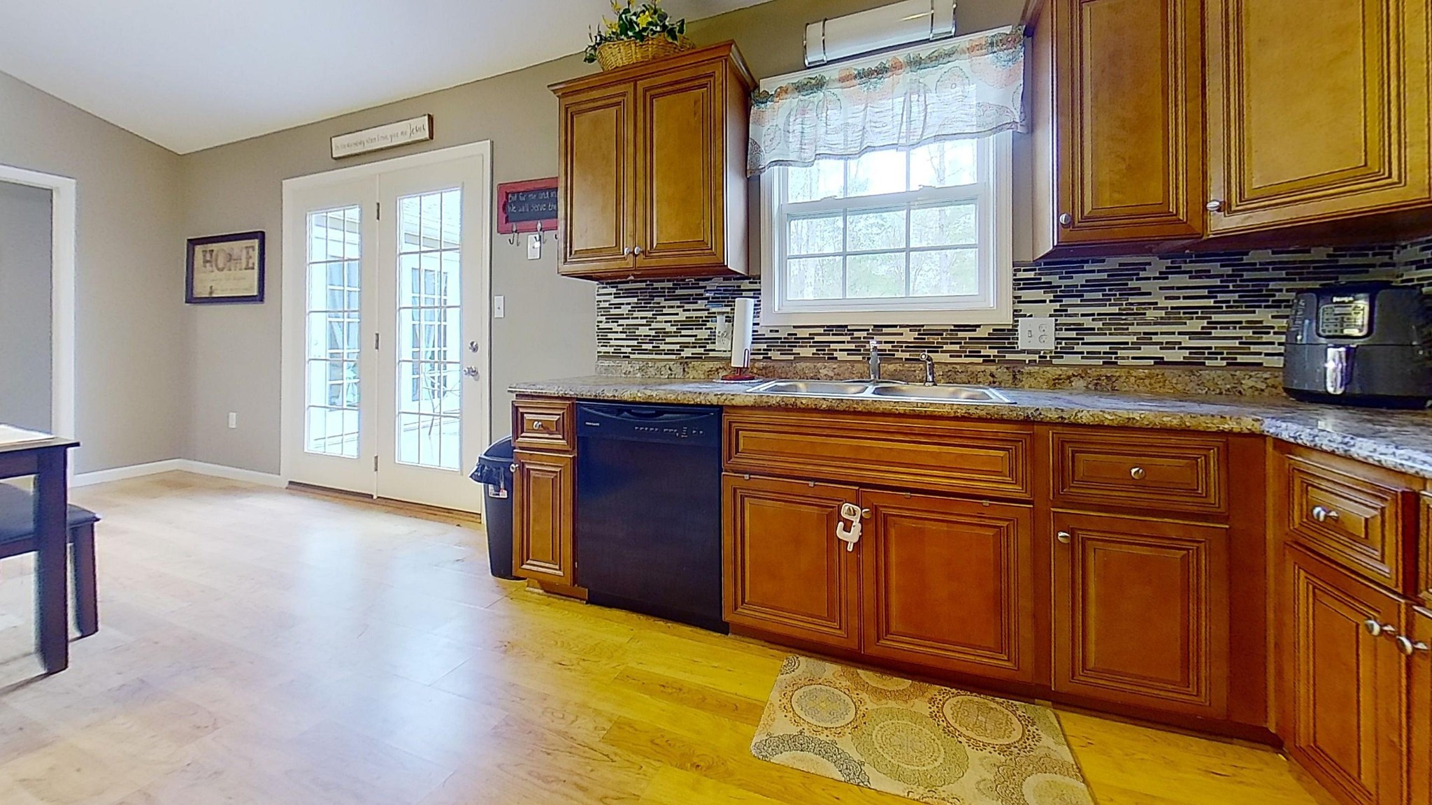 1110 Toomey Road Oneida, TN 37841 - Photo 13 of 30 a kitchen with stainless steel appliances granite countertop wooden cabinets a sink and dishwasher with wooden floor