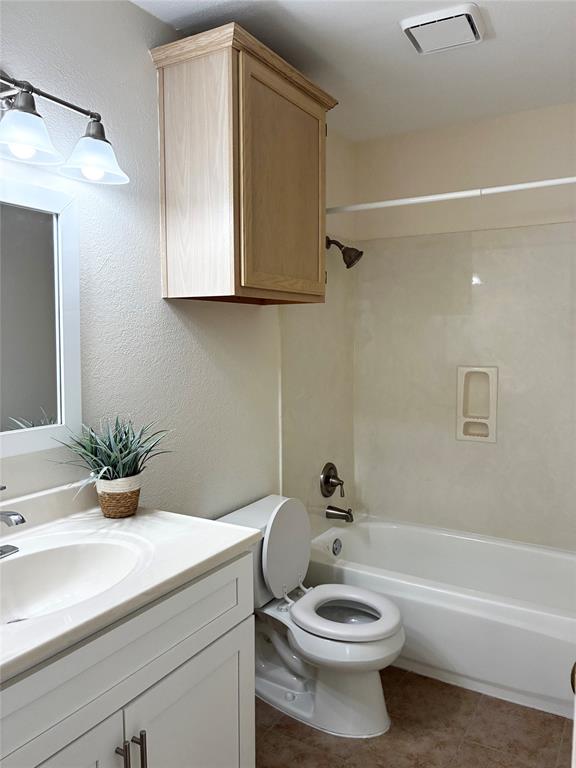 7936 Tournament Road Frisco, TX 75035 - Photo 17 of 28 a bathroom with a sink a toilet and shower