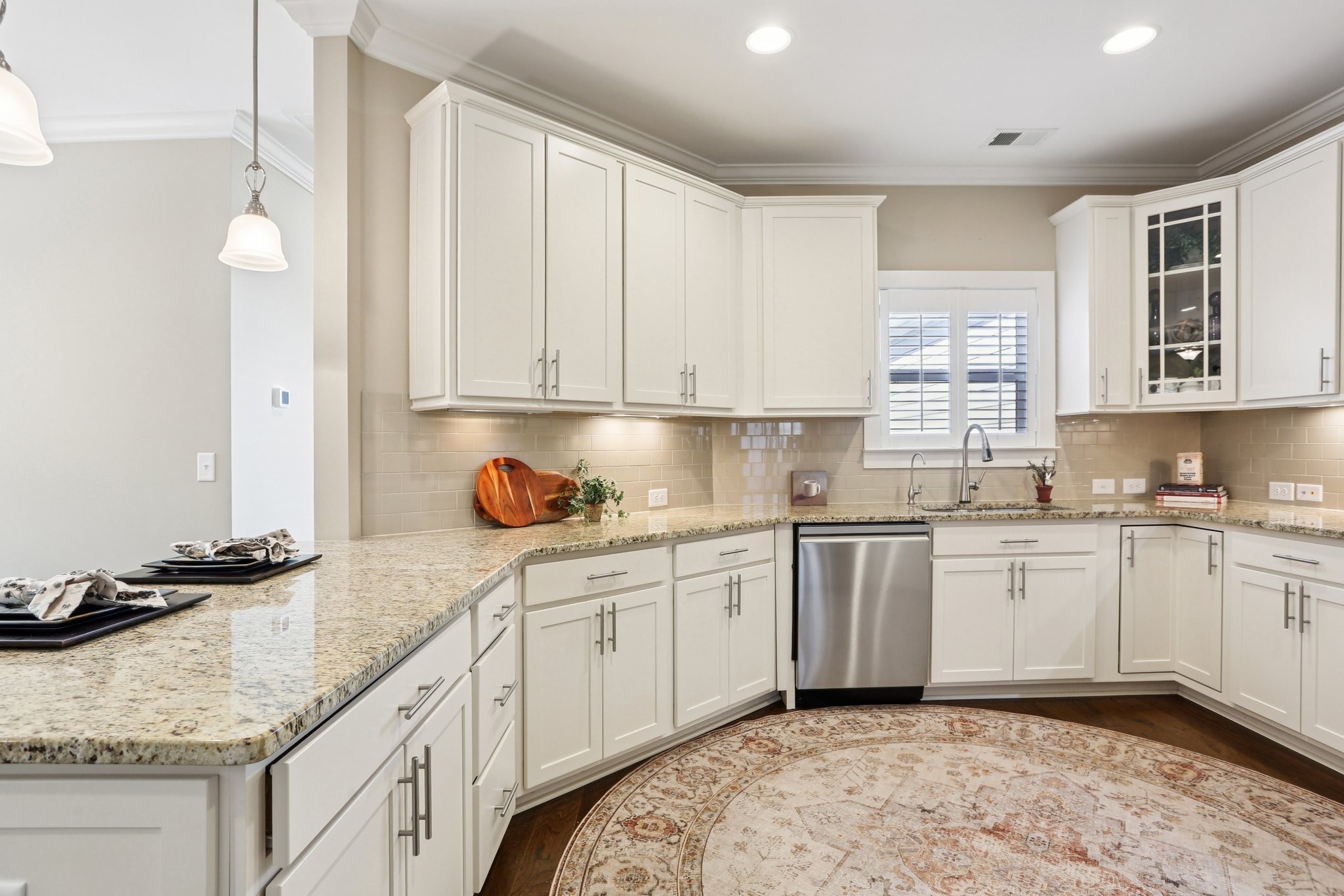 3014 Mainstream Drive Franklin, TN 37064 - Photo 19 of 69 a kitchen with granite countertop sink stove and cabinets