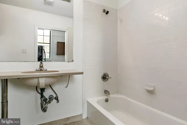 a bathroom with a sink and a bathtub