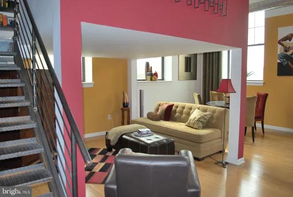 a bedroom with furniture and a book shelf
