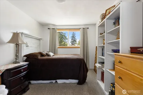 a bed room with a bed and a window