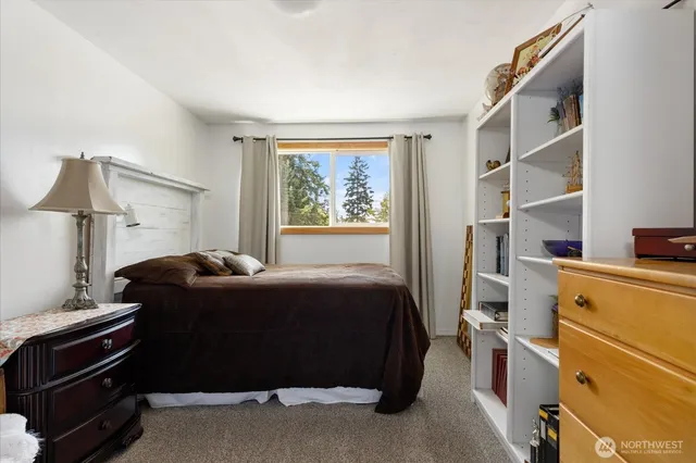 a bed room with a bed and a window