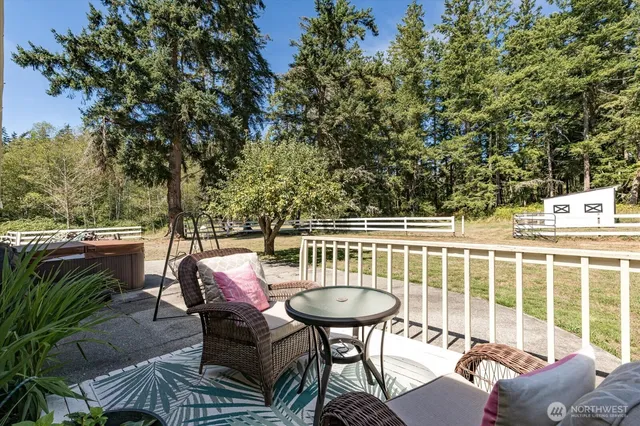 a view of a chairs and table in the patio