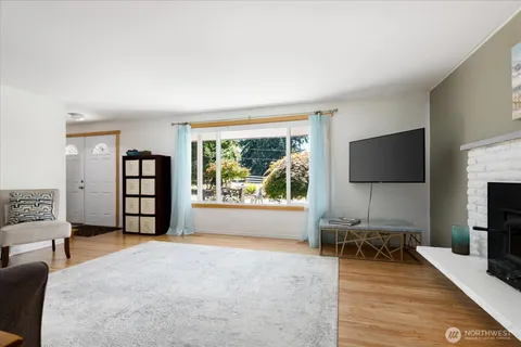 a view of a livingroom with furniture and a flat screen tv