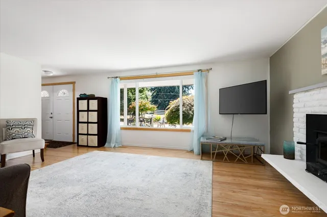 a view of a livingroom with furniture and a flat screen tv