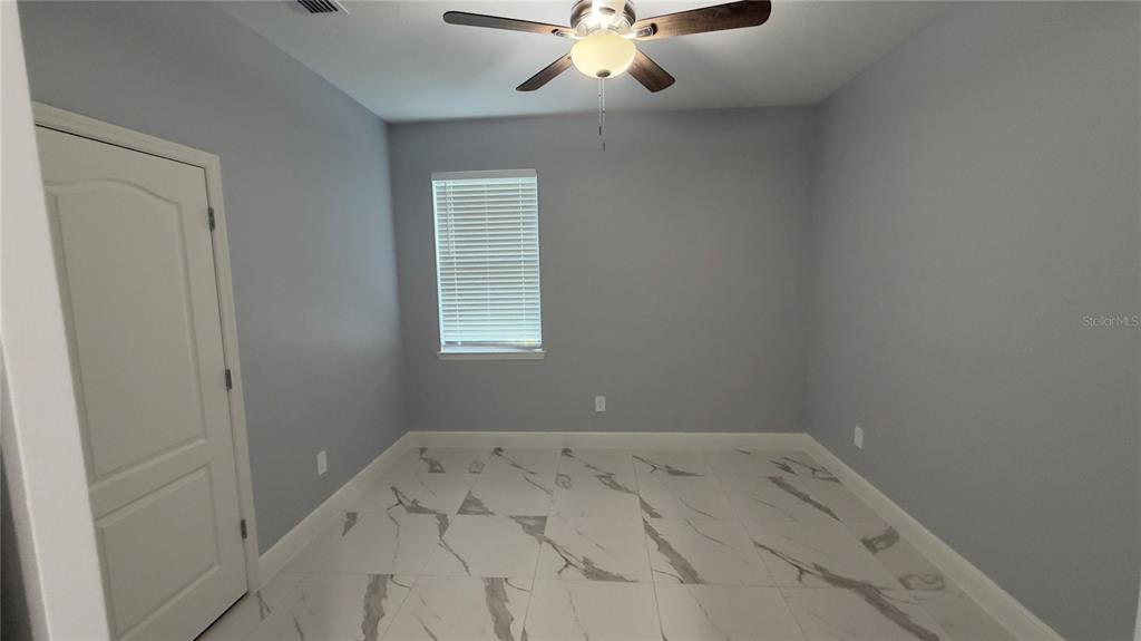706 South Thacker Avenue Kissimmee, FL 34741 - Photo 25 of 36 an empty room with a window