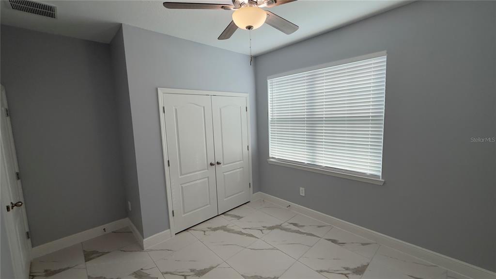 706 South Thacker Avenue Kissimmee, FL 34741 - Photo 28 of 36 a view of an empty room with a window