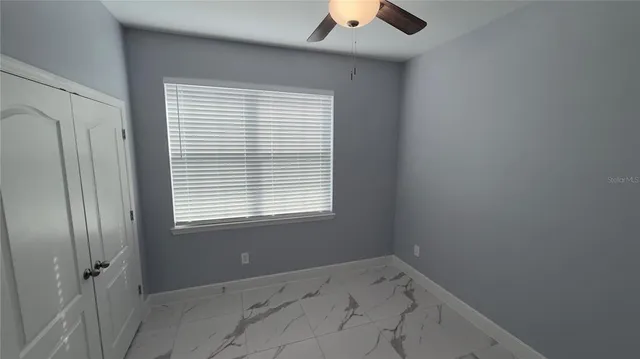 a bathroom with a shower sink and mirror