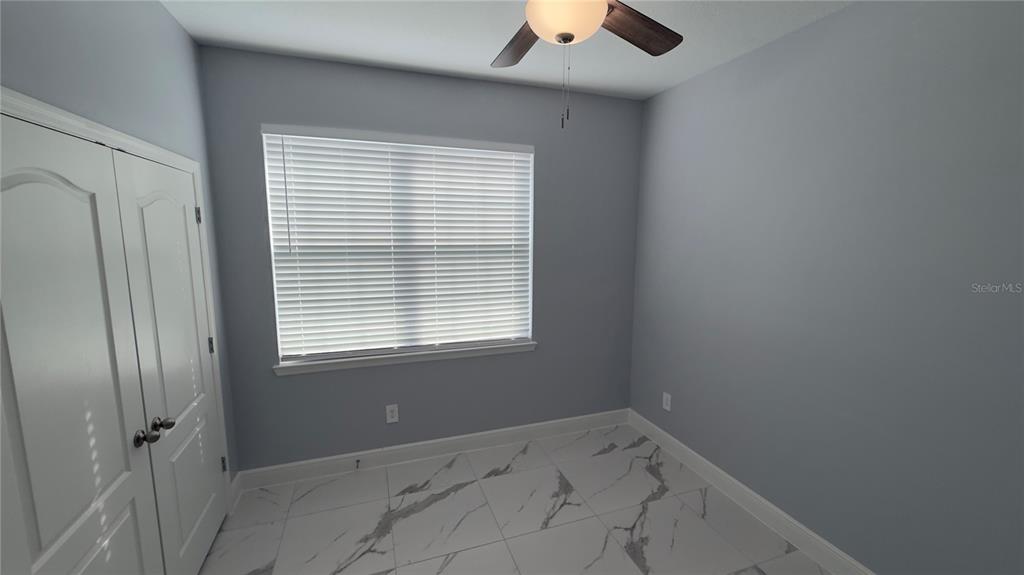 706 South Thacker Avenue Kissimmee, FL 34741 - Photo 29 of 36 an empty room with a window