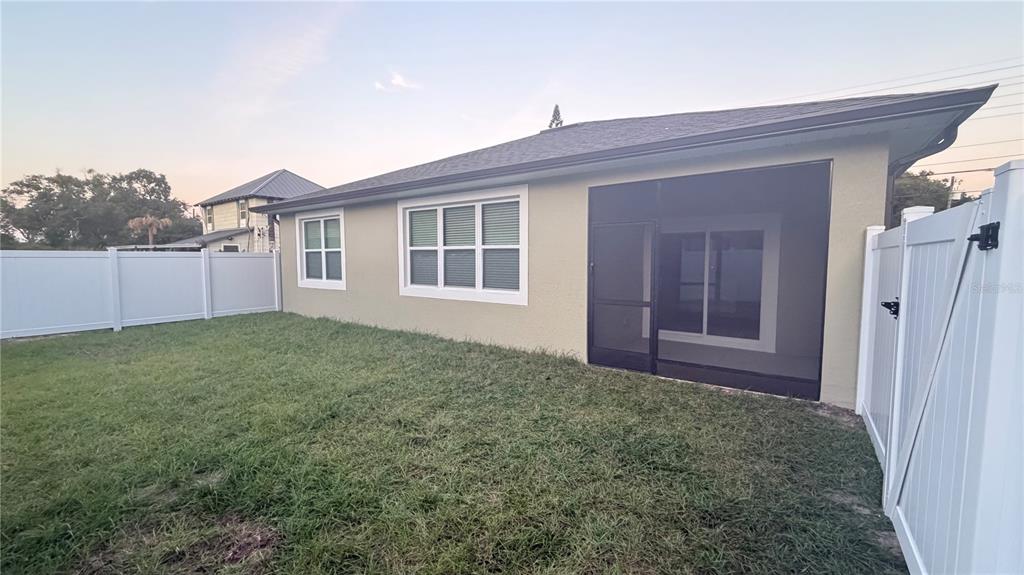 706 South Thacker Avenue Kissimmee, FL 34741 - Photo 35 of 36 front view of a house with a yard
