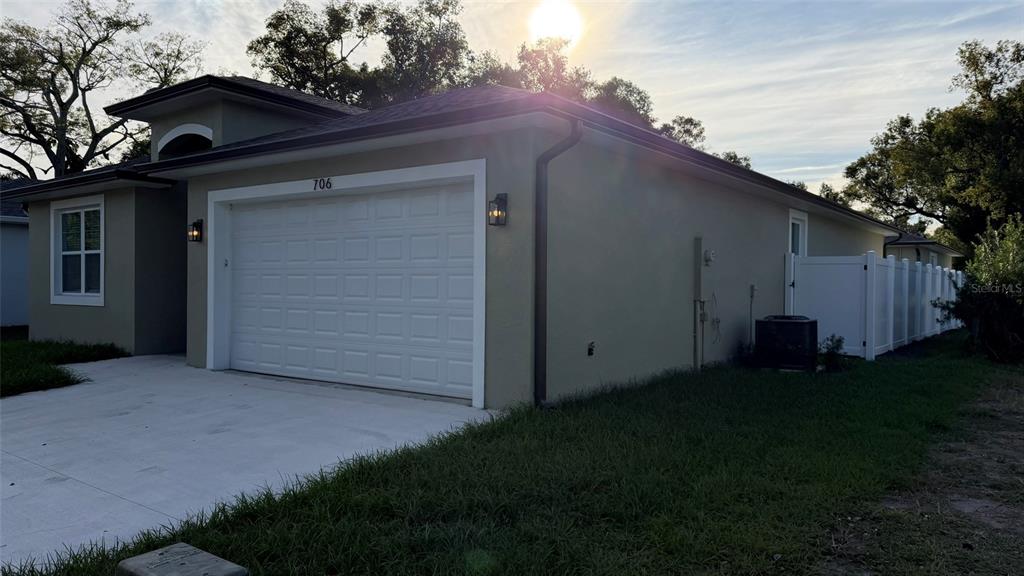 706 South Thacker Avenue Kissimmee, FL 34741 - Photo 7 of 36 a backyard of a house with lots of green space