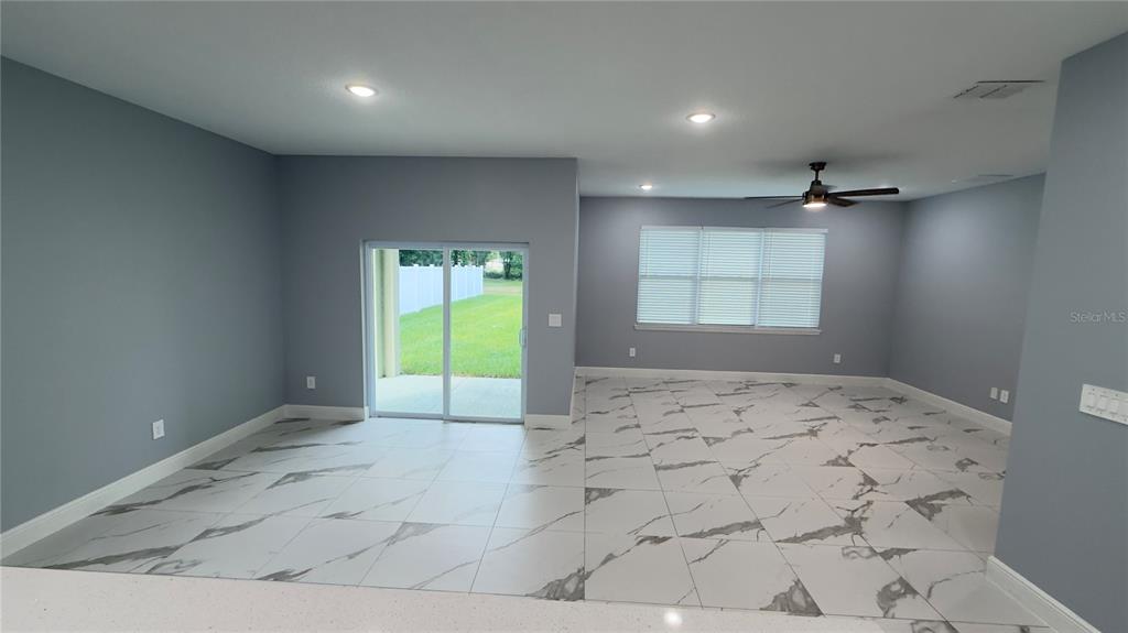 706 South Thacker Avenue Kissimmee, FL 34741 - Photo 8 of 36 a view of an empty room and window