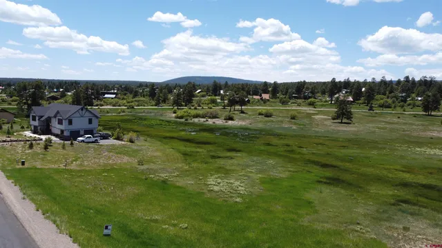 a view of a golf course with a lake