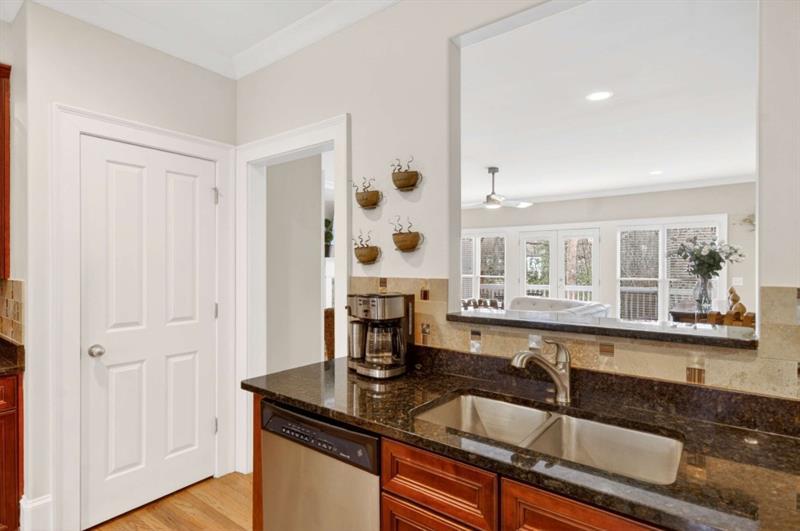 2660 Colgan Court Southeast Atlanta, GA 30317 - Photo 18 of 50 a kitchen with granite countertop a sink and cabinets