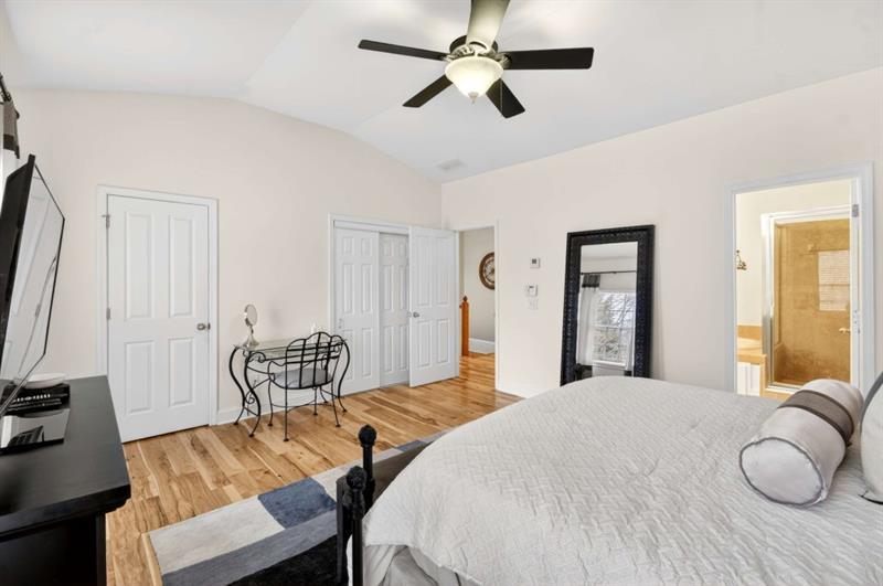 2660 Colgan Court Southeast Atlanta, GA 30317 - Photo 29 of 50 a bedroom with a bed and wooden floor