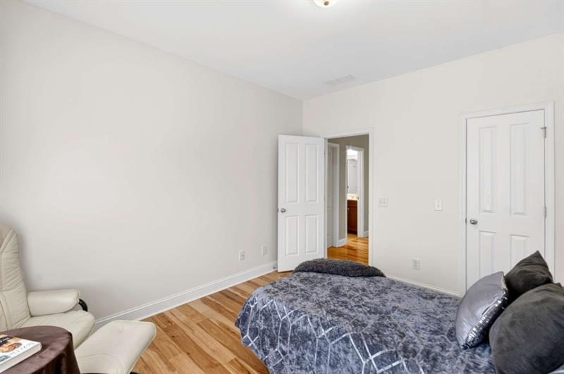 2660 Colgan Court Southeast Atlanta, GA 30317 - Photo 35 of 50 a bedroom with a bed and a couch