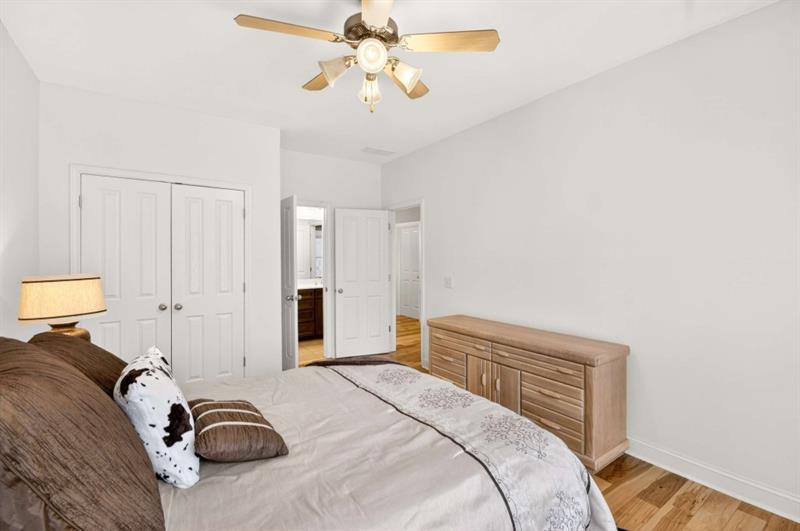 2660 Colgan Court Southeast Atlanta, GA 30317 - Photo 37 of 50 a bedroom with a bed and a chandelier