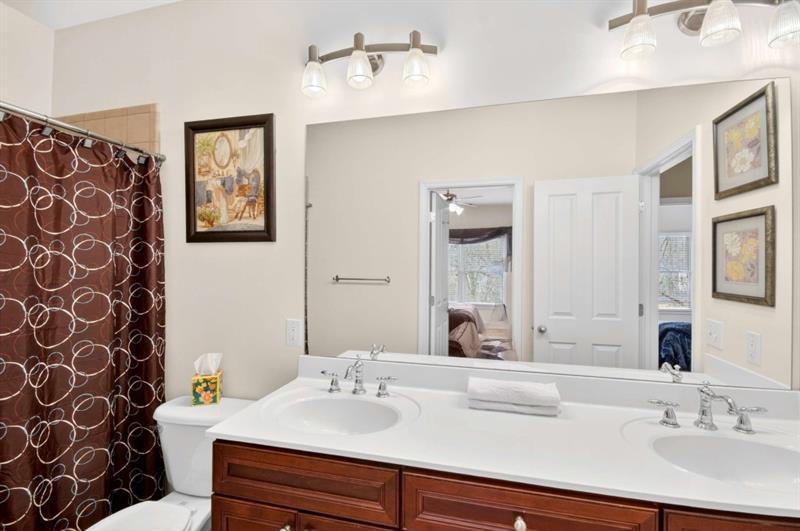 2660 Colgan Court Southeast Atlanta, GA 30317 - Photo 38 of 50 a bathroom with a sink and a mirror