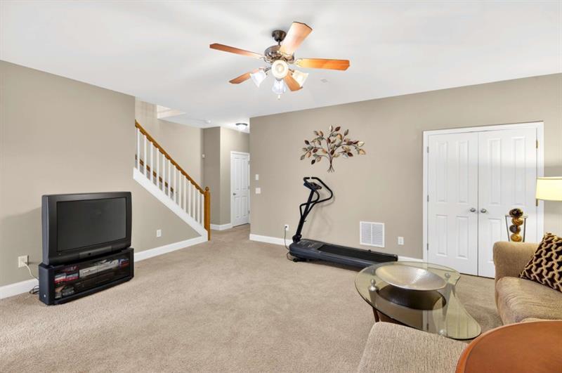 2660 Colgan Court Southeast Atlanta, GA 30317 - Photo 41 of 50 a living room with furniture a flat screen tv and a window