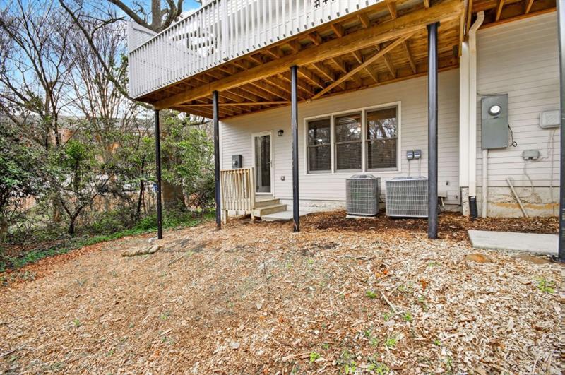 2660 Colgan Court Southeast Atlanta, GA 30317 - Photo 44 of 50 a porch with a table and chairs under an umbrella