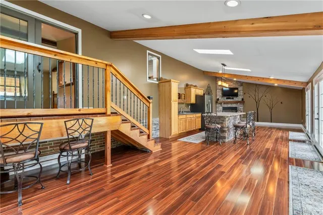 a view of a chairs with wooden floor