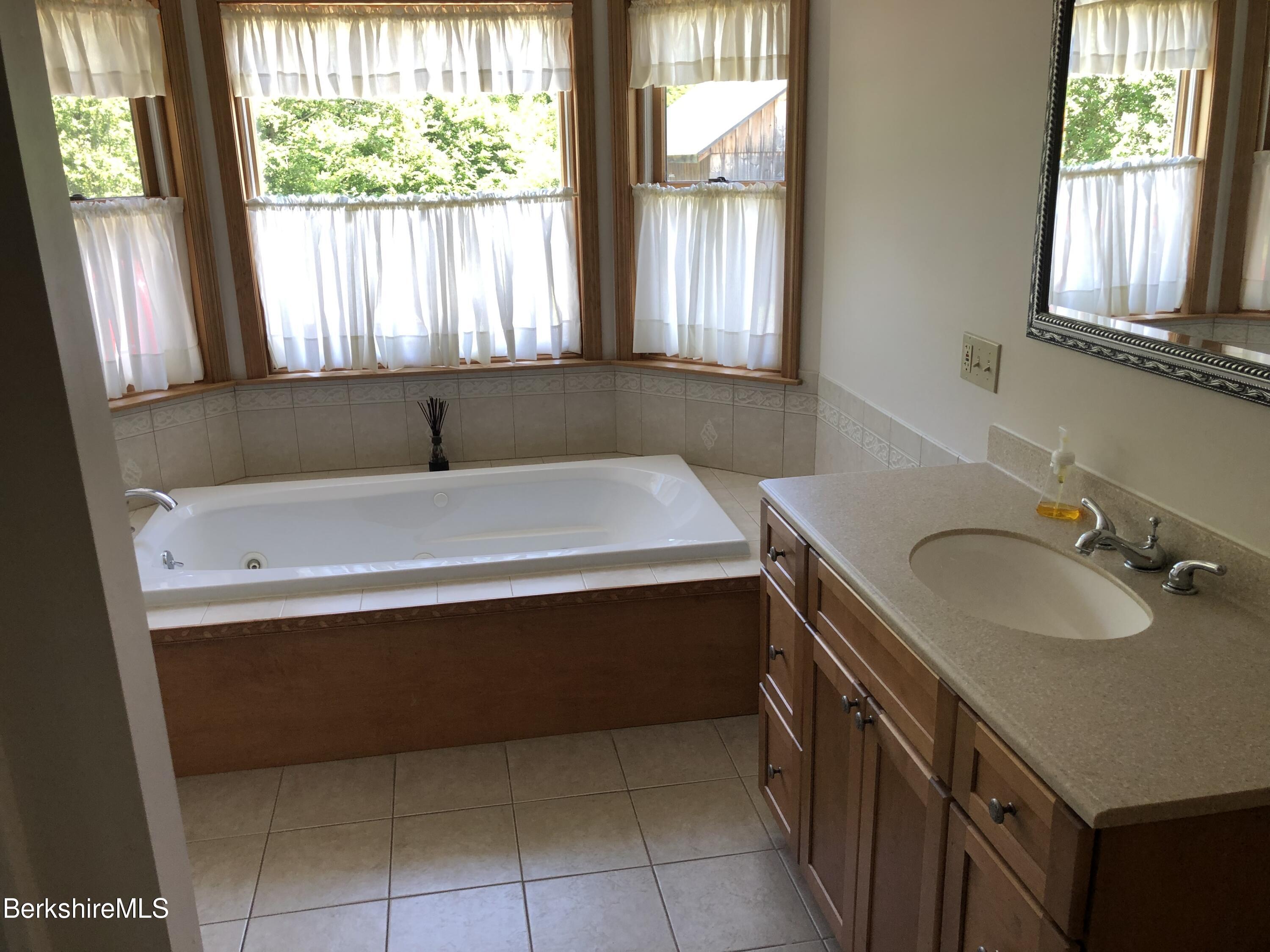1387 East Windsor Road Windsor, MA 01270 - Photo 16 of 38 a bathroom with a sink and a bathtub