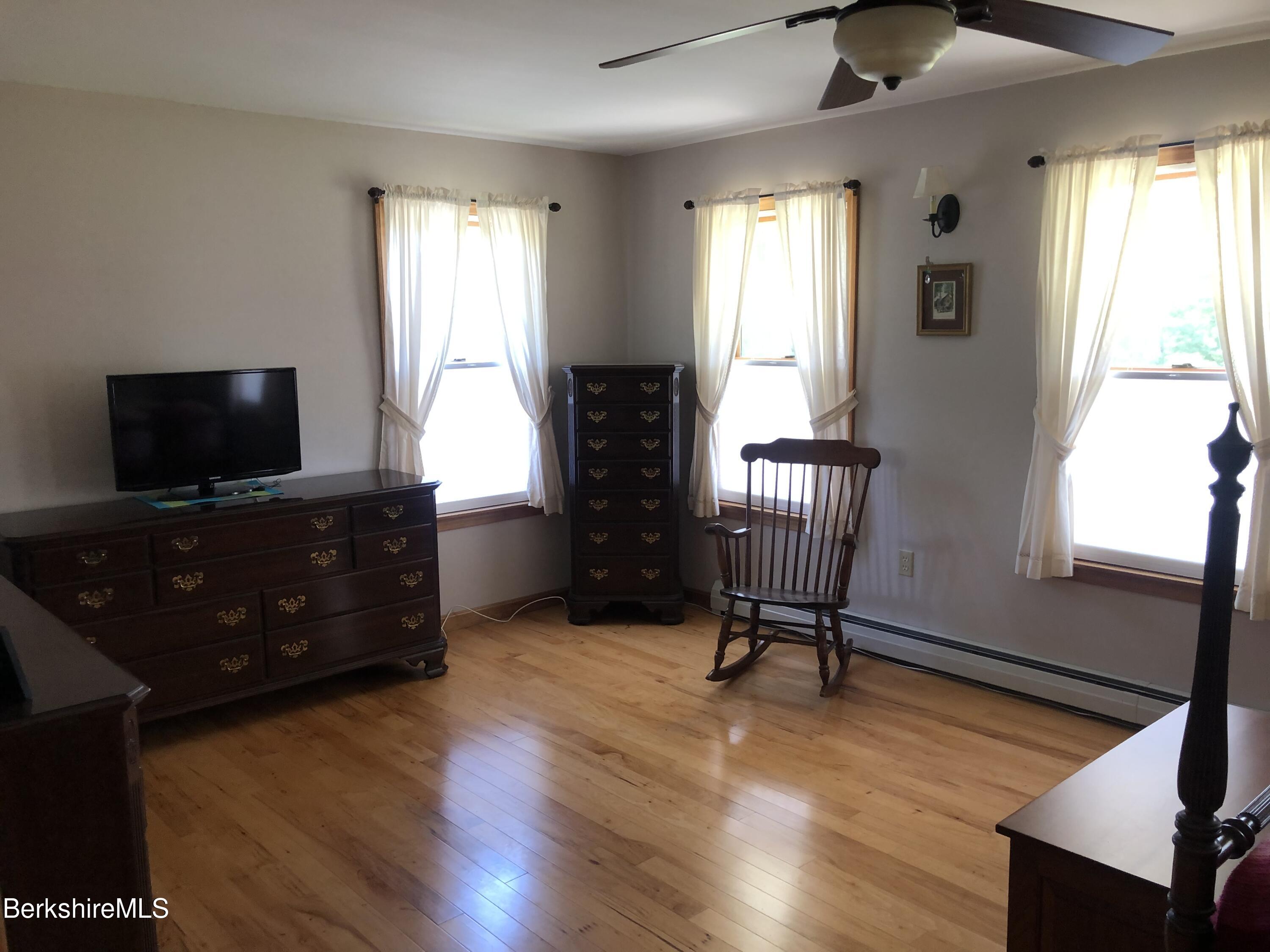1387 East Windsor Road Windsor, MA 01270 - Photo 20 of 38 a living room with furniture and a flat screen tv