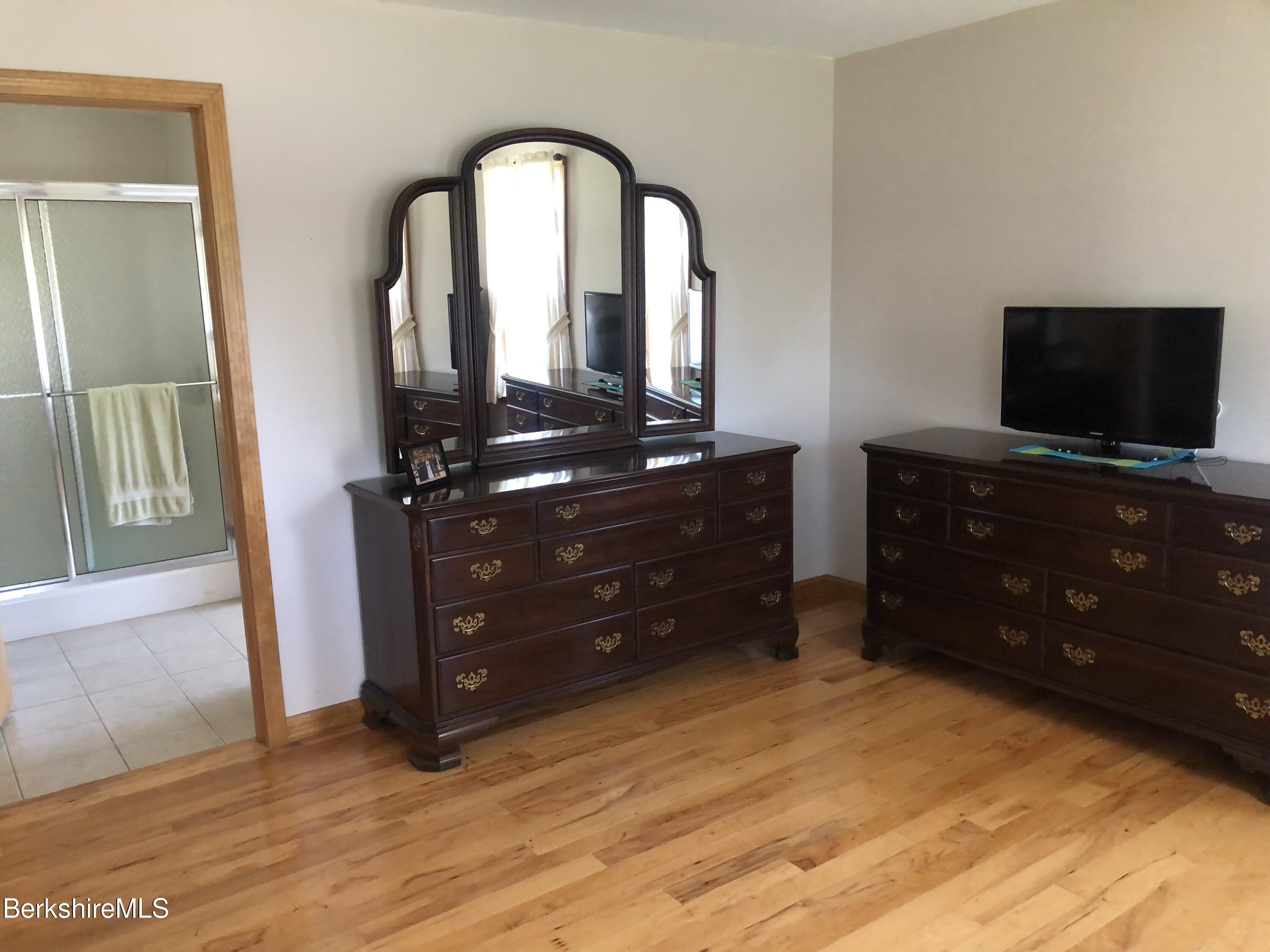 1387 East Windsor Road Windsor, MA 01270 - Photo 21 of 38 a living room with furniture and a flat screen tv