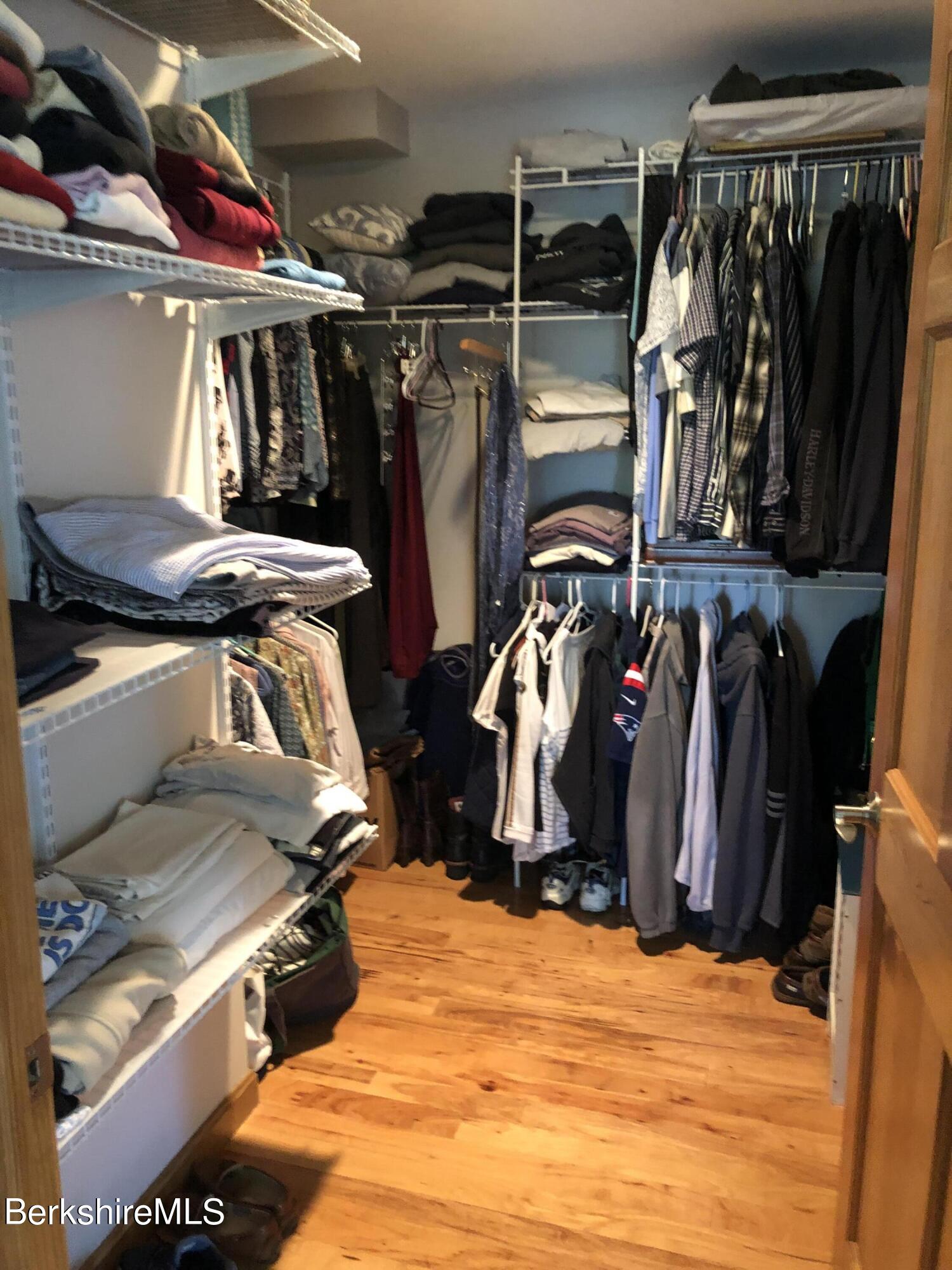 1387 East Windsor Road Windsor, MA 01270 - Photo 22 of 38 a view of walk in closet with clothes and shoes