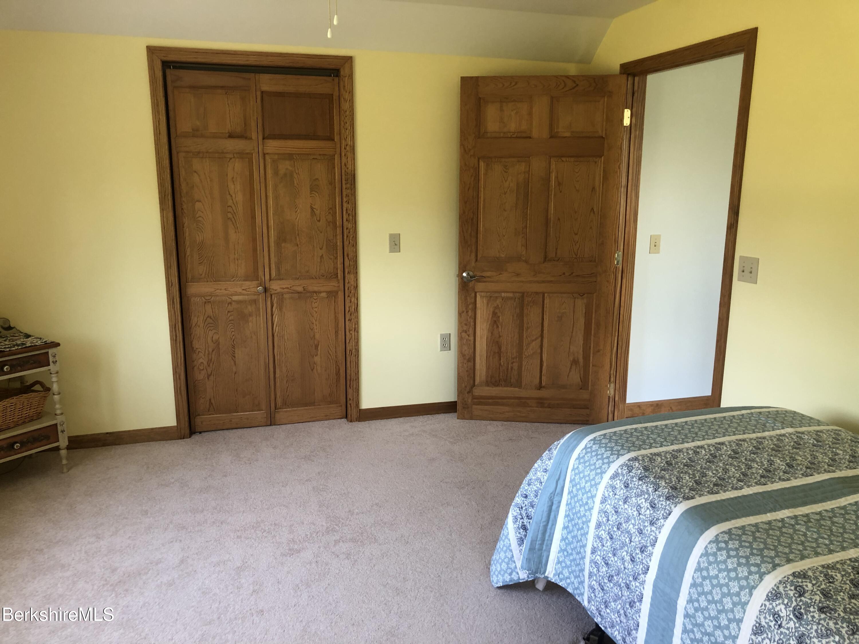 1387 East Windsor Road Windsor, MA 01270 - Photo 24 of 38 a bedroom with a bed and a mirror
