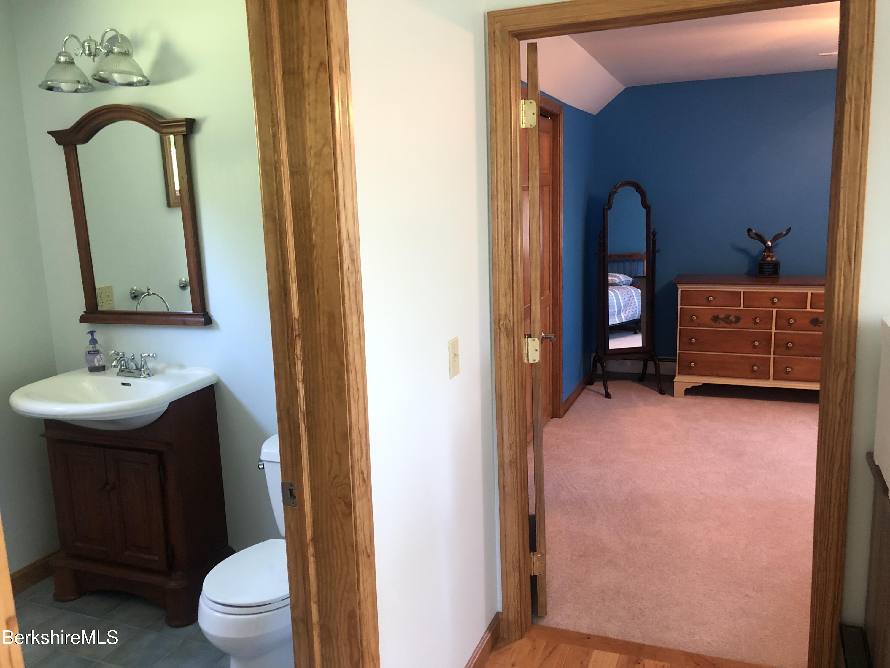 1387 East Windsor Road Windsor, MA 01270 - Photo 29 of 38 a bathroom with a sink a toilet and a mirror