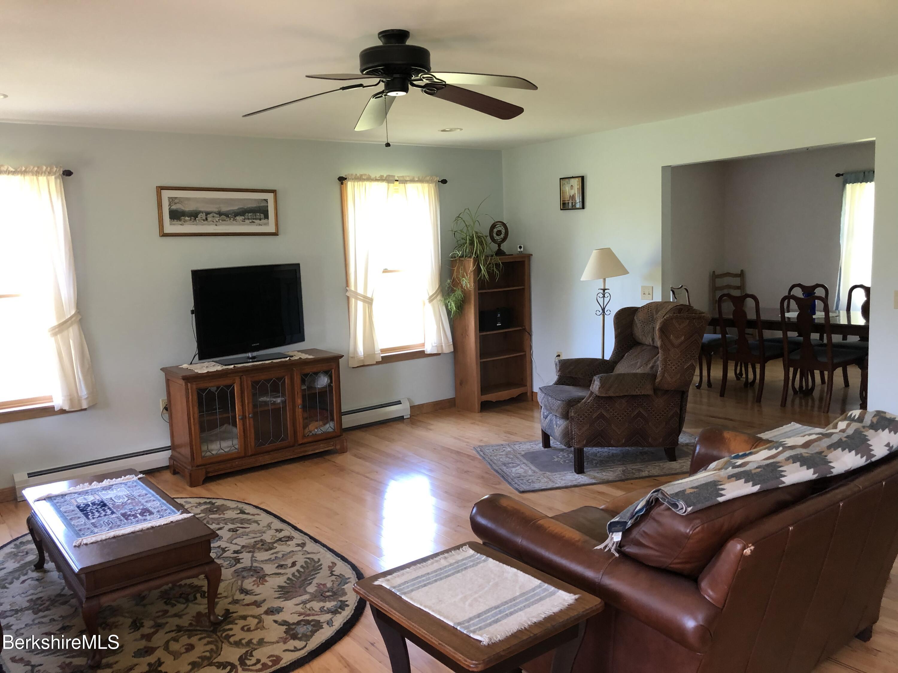 1387 East Windsor Road Windsor, MA 01270 - Photo 6 of 38 a living room with furniture and a flat screen tv