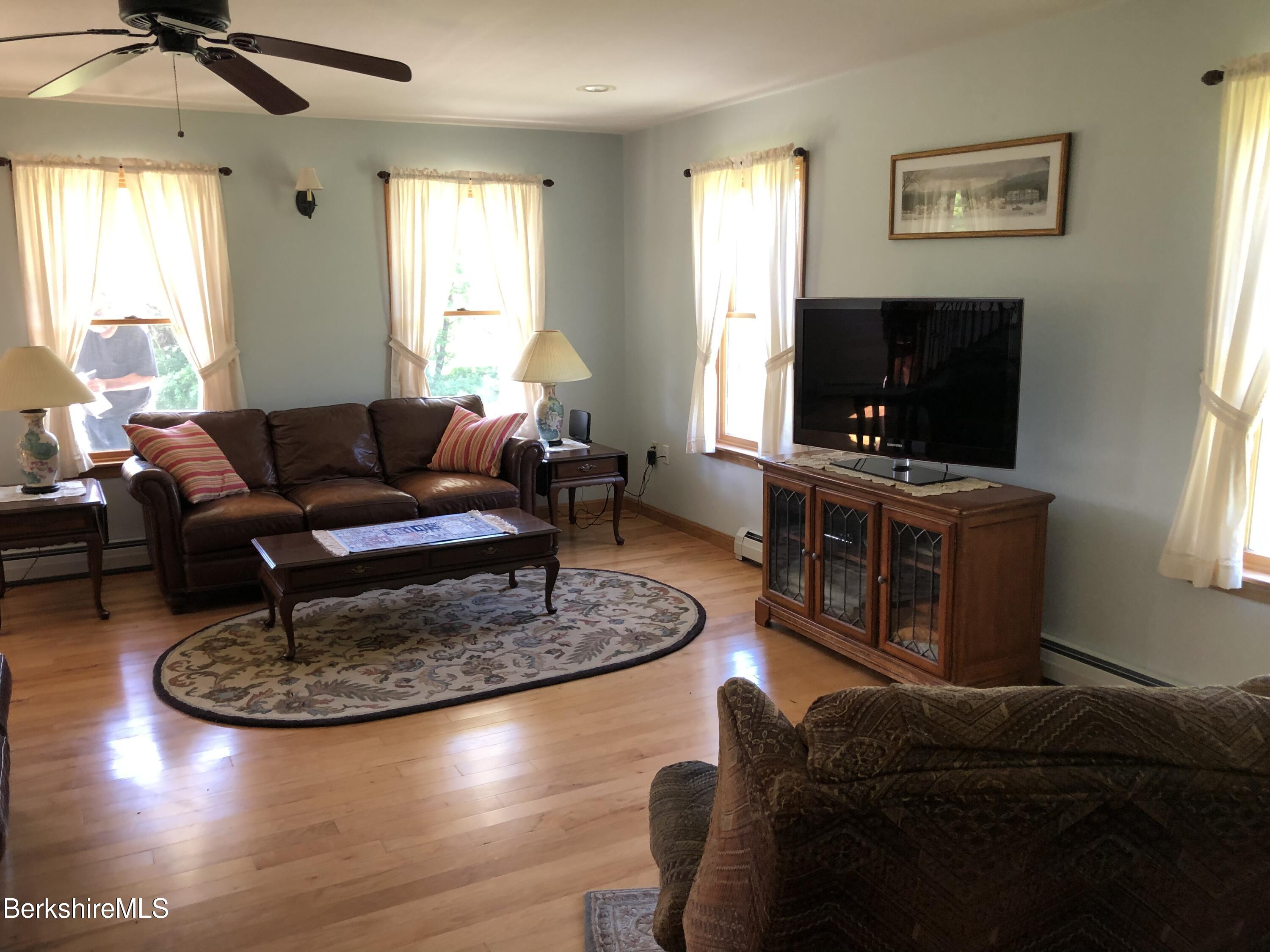 1387 East Windsor Road Windsor, MA 01270 - Photo 7 of 38 a living room with furniture and a flat screen tv