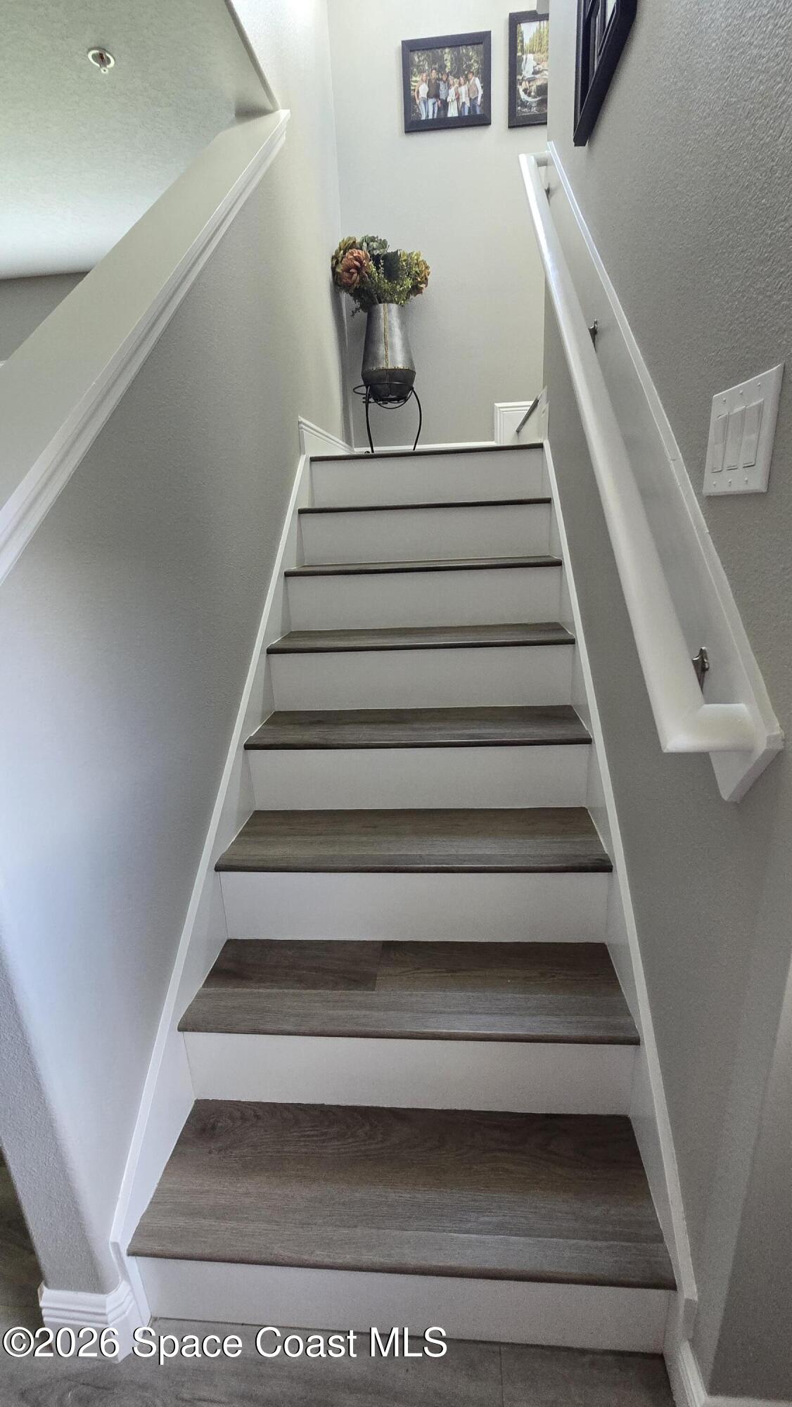 1315 Lara Circle, Unit 106 Rockledge, FL 32955 - Photo 11 of 18 LVP Stairs