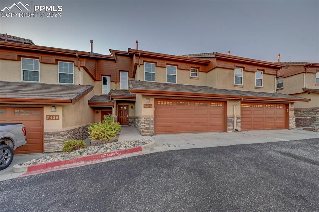 front view of a house with a street