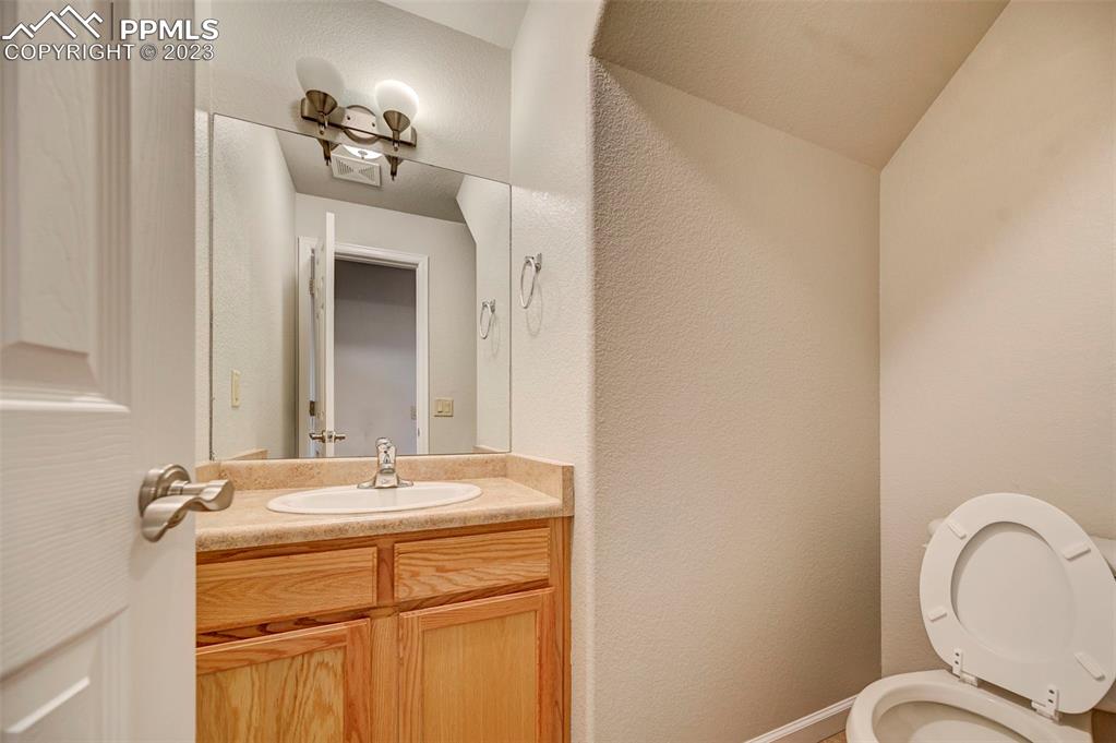 5433 Prominence Point Colorado Springs, CO 80923 - Photo 13 of 26 a bathroom with a sink and a mirror