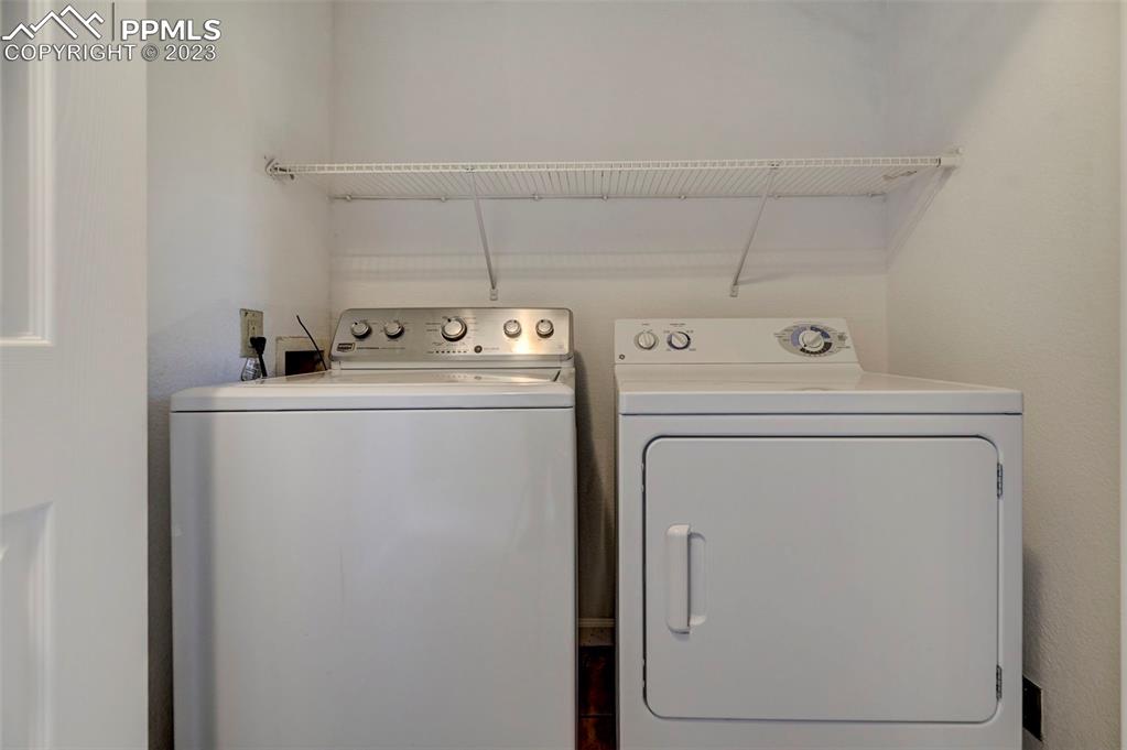 5433 Prominence Point Colorado Springs, CO 80923 - Photo 15 of 26 a utility room with dryer and washer