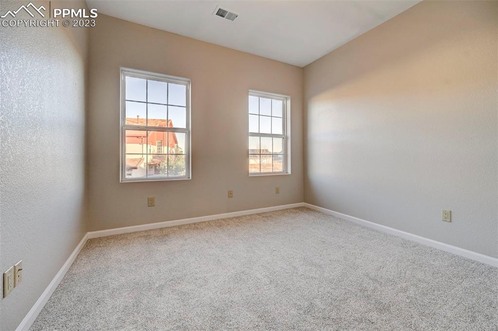 5433 Prominence Point Colorado Springs, CO 80923 - Photo 16 of 26 an empty room with windows