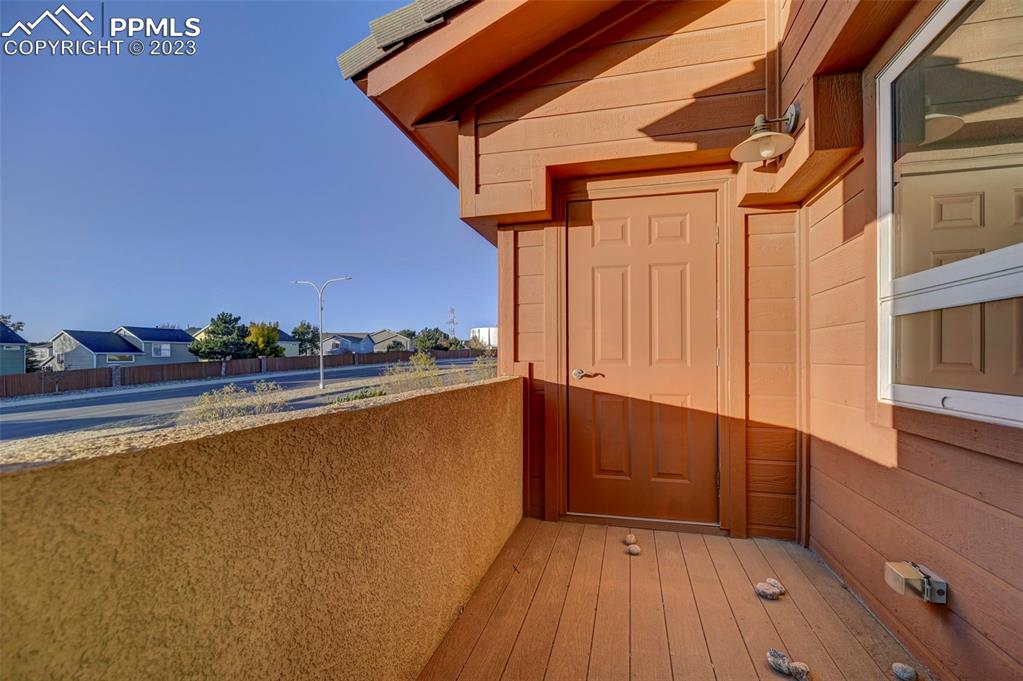 5433 Prominence Point Colorado Springs, CO 80923 - Photo 25 of 26 a view of balcony with wooden floor